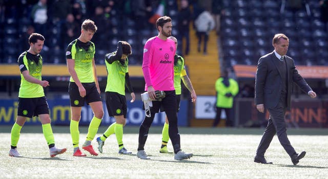 Celtic manager Brendan Rodgers and players appear dejected after losing to Kilmarnock