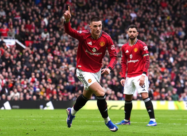 Benjamin Sesko celebrates scoring United's third goal as Bruno Fernandes looks on