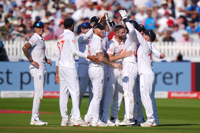 England’s Jamie Smith (third right, wearing helmet) celebrates with team-mates after catching out India’s Shubman Gill (not pictured)