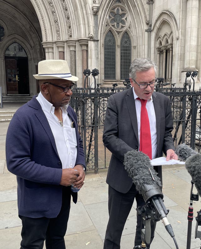 Errol Campbell Jr (left) and solicitor Matt Foot speaking outside the Royal Courts of Justice after Mr Campbell Jr’s father, Errol Campbell, was posthumously cleared at the Court of Appeal