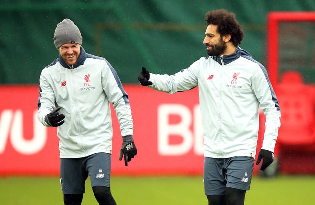 Alberto Moreno (left) (PA)