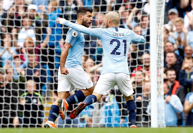 Sergio Aguero, left, celebrates a goal with David Silva