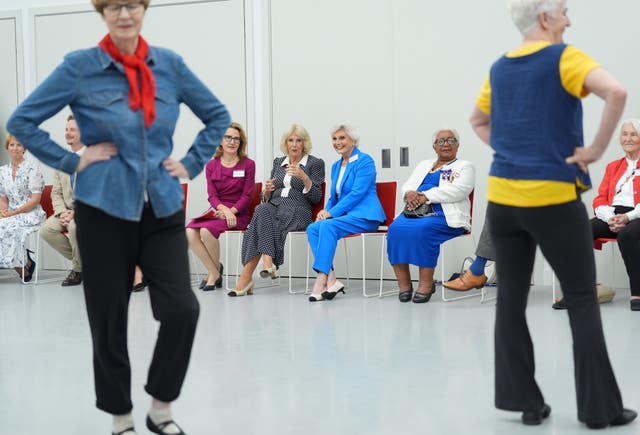 The Queen watching a dance class