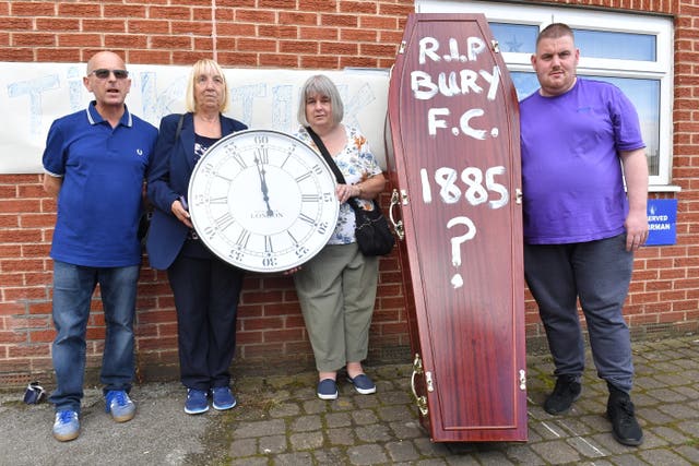 Bury fans deliver a symbolic coffin at Gigg Lane 