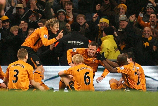Jimmy Bullard, second left, gives a mock team talk to his Hull team-mates