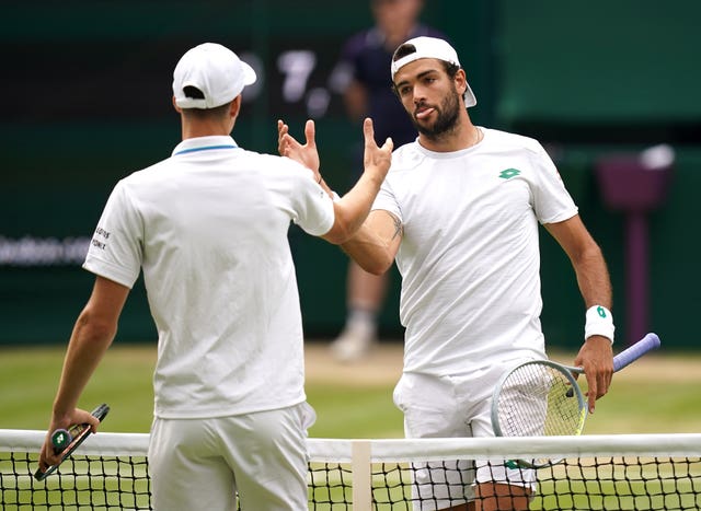 Matteo Berrettini embraces Hubert Hurkacz