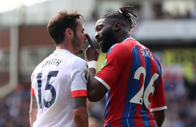 Crystal Palace's Bakary Sako and Bouremouth's Adam Smith get up close and personal during a five-goal thriller at Selhurst Park