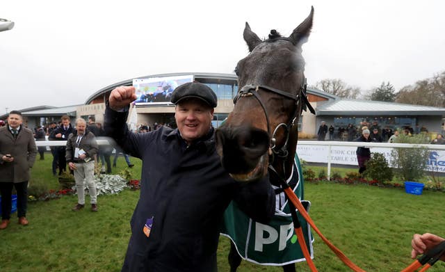 Gordon Elliott celebrates with Conflated after the Irish Gold Cup