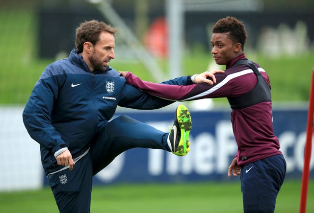 Former England under-21s coach Gareth Southgate (left) warms up in training. (PA)
