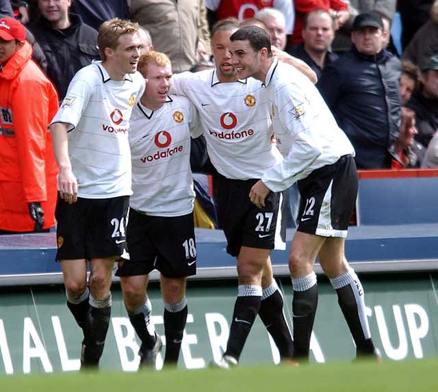 Manchester United's Paul Scholes (second left) celebrates scoring against Arsenal in the FA Cup semi-final. (PA)