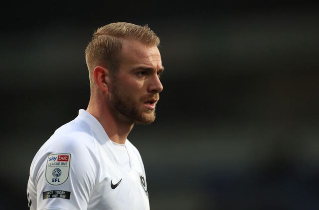Portsmouth defender Jack Whatmough tested positive for Covid-19 after feeling unwell ahead of Friday's win at Hull