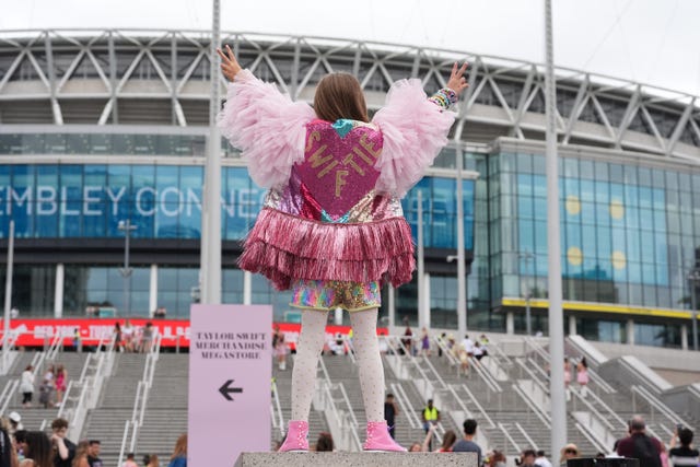 A young fan poses outside Wembley Stadium