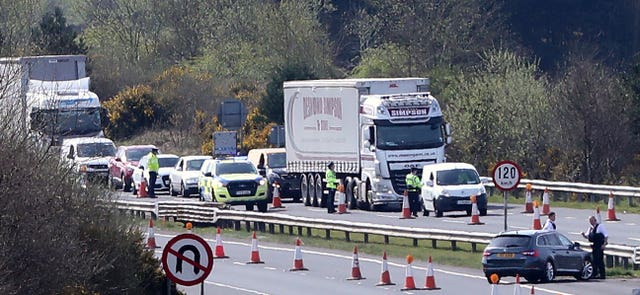 Gardai and PSNI officers mount armed coronavirus checkpoints on the border with Northern Ireland at Carrickarnon, Co Louth