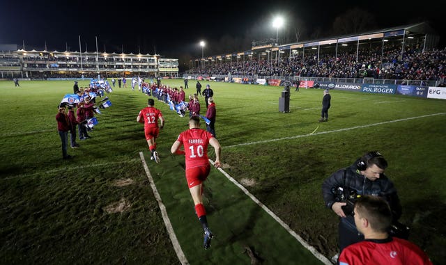 Owen Farrell, foreground, takes to the field with Saracens