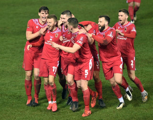 Chorley's players celebrate Mike Calveley's winner in the second round at Peterborough