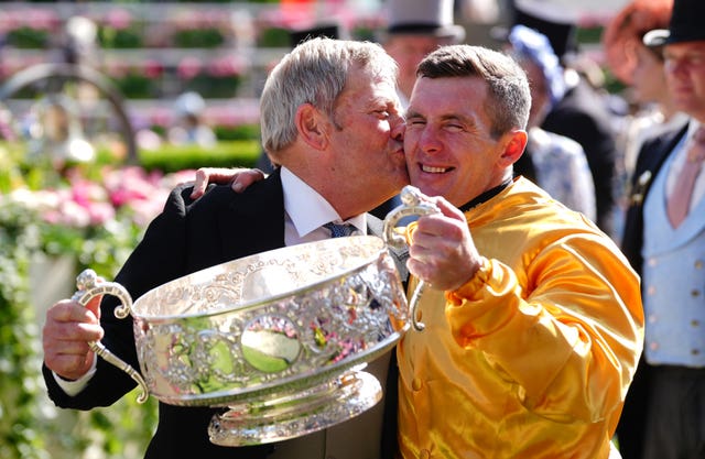 Trainer Joe Murphy and jockey Gary Carroll celebrate with the Coronation Stakes trophy