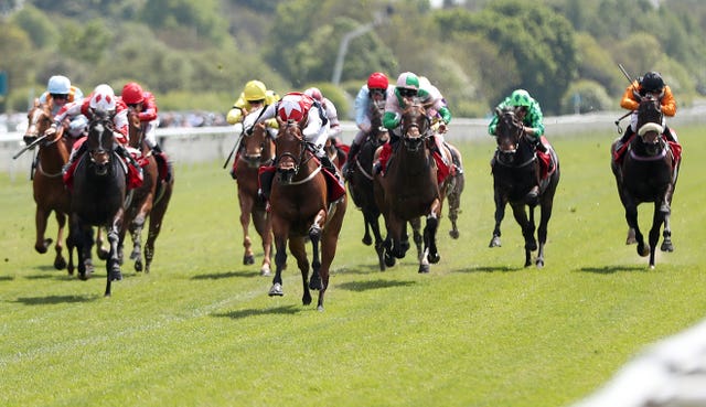Copper Knight (centre, red and white cap) is heading to Epsom