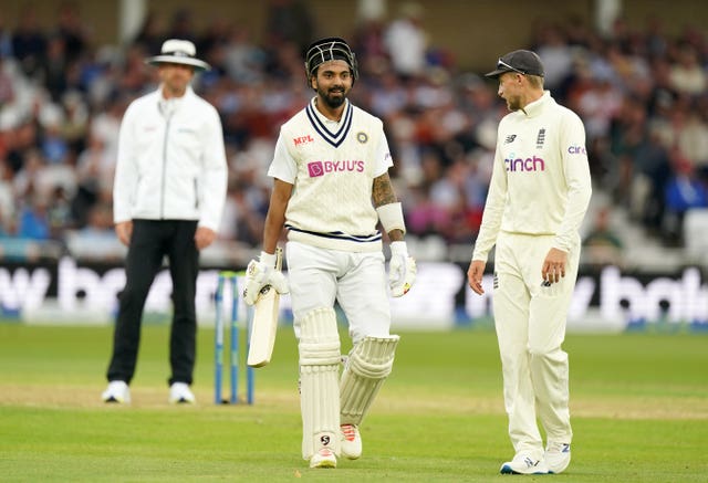 KL Rahul, centre, speaks to Joe Root as the teams leave the field