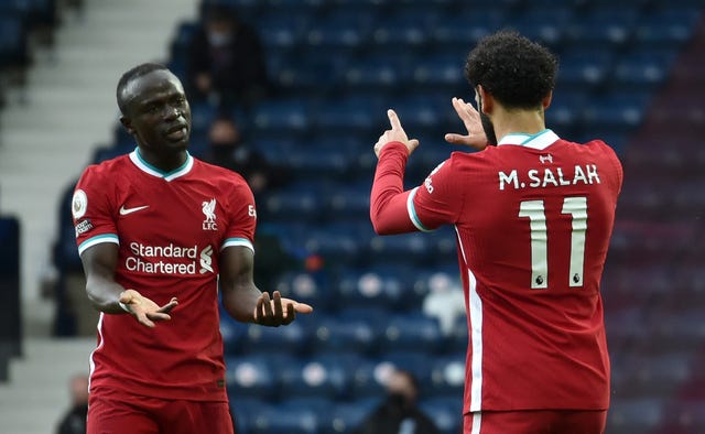 Sadio Mane celebrates with Mohamed Salah