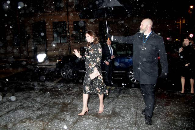 The Duchess of Cambridge braved the snow in central London in an Orla Kiely dress (Yui Mok/PA)