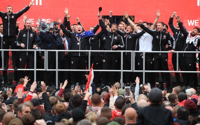 Sheffield United players and manager Chris Wilder on stage during the promotion parade