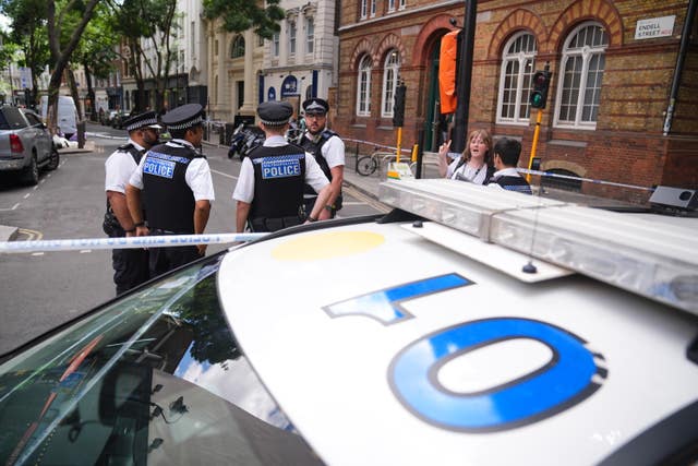 Emergency services near the scene on Endell Street in Covent Garden, central London