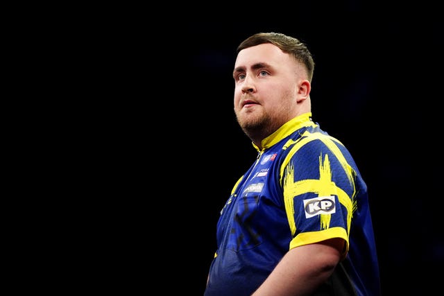 Luke Littler competing in the Premier League of Darts final in 2026.