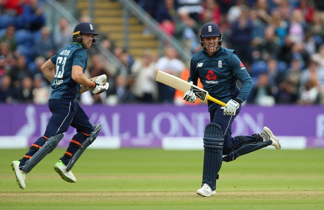Jason Roy, right, celebrates after reaching his century with Jos Buttler
