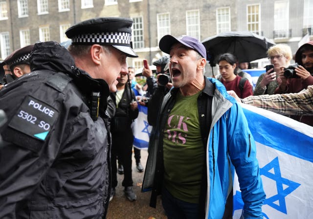 A police officer speaking to a counter-protester