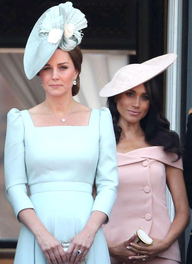 The Duchess of Cambridge (left) and the Duchess of Sussex on the balcony of Buckingham Palace, in central London, following the Trooping the Colour ceremony at Horse Guards Parade as the Queen celebrates her official birthday in 2018