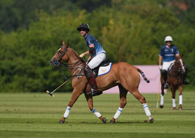 The Prince of Wales on a horse playing in a polo match