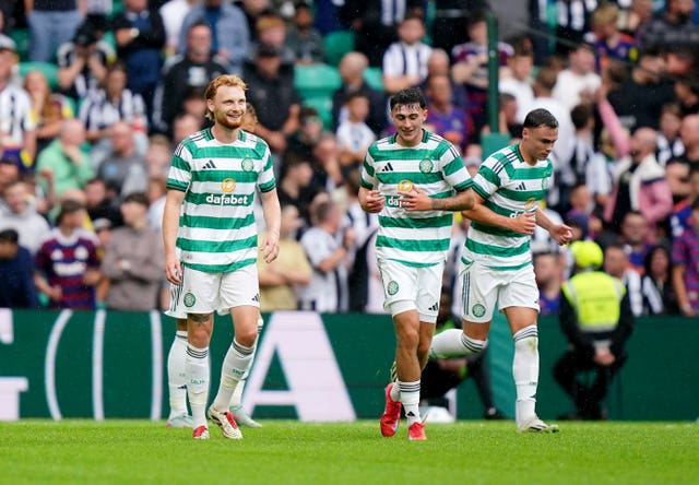 Celtic’s Liam Scales (left) celebrates his goal