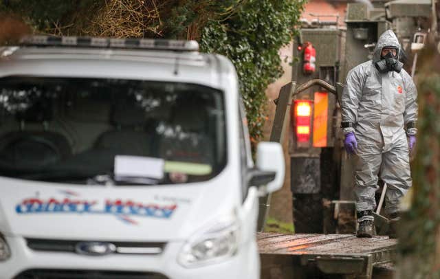 Investigators in protective clothing remove a van from an address in Winterslow near Salisbury in Wiltshire, as police and members of the armed forces continue to investigate the suspected nerve agent attack on Russian double agent Sergei Skripa (Andrew Matthews/PA)