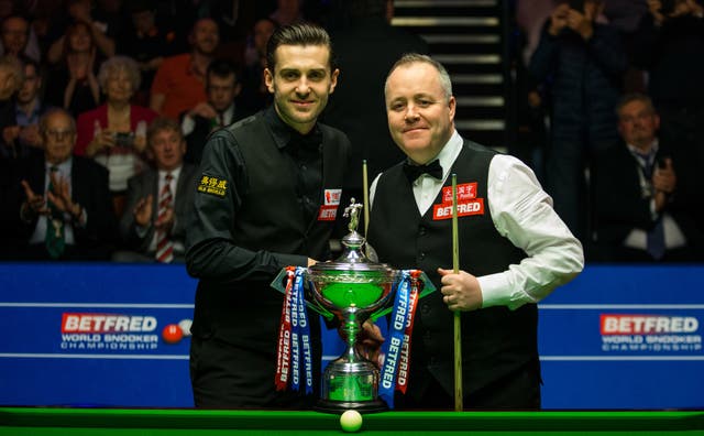 Mark Selby and John Higgins shake hands before the 2017 World Snooker Championship final