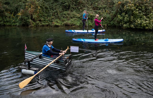 Michael Stanley rows along the Chichester canal in his home-made rowing boat