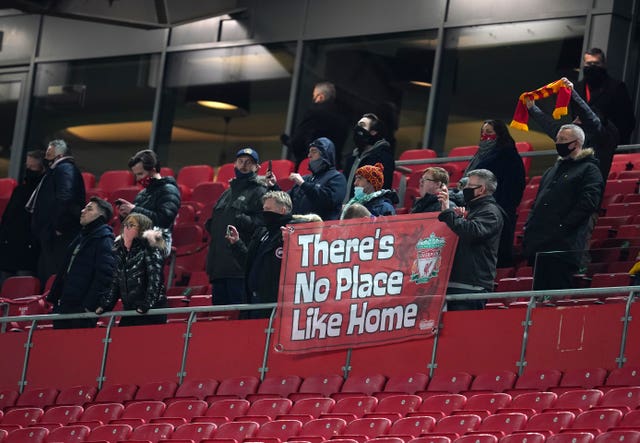Liverpool fans display a banner reading 'There's no place like home'