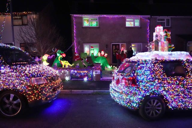 VW vans, part of a group of 125 vehicles called the Christmas Dubs, decked out in thousands of lights at the home of Rory Thorner in Winterbourne, south Gloucestershire. Rory’s parents, Molly and James Thorner, have created a dinosaur-themed Christmas lights display at their home to raise money for the Grand Appeal - the charity of Bristol Children’s Hospital