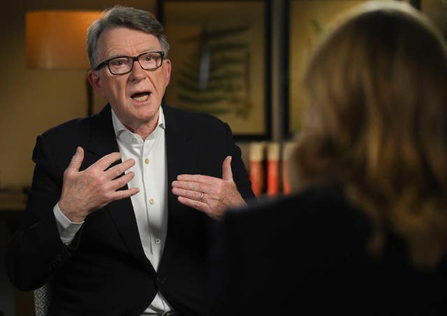 The back of Laura Kuenssberg's head is in the foreground as Lord Mandelson gestures while he speaks to her