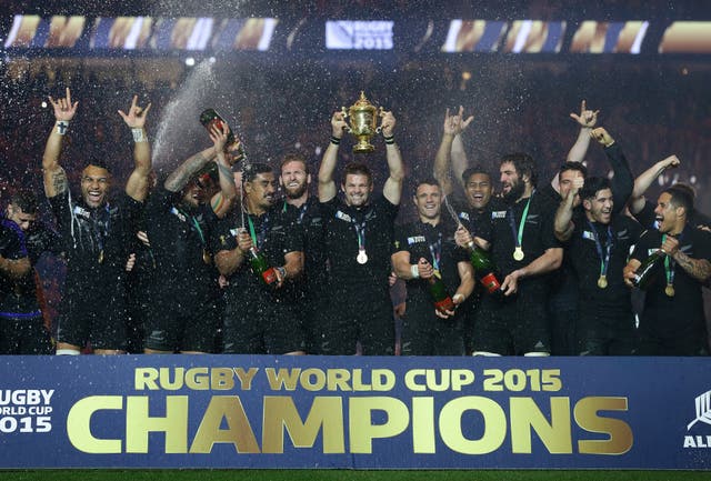New Zealand captain Richie McCaw, centre, lifts the World Cup trophy in 2015 flanked by his team