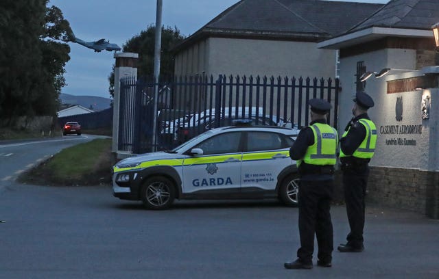 Members of An Garda stand outside Casement aerodrome, Baldonnel in 2021