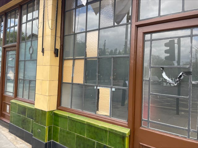 Boarded up windows at the York & Albany pub 
