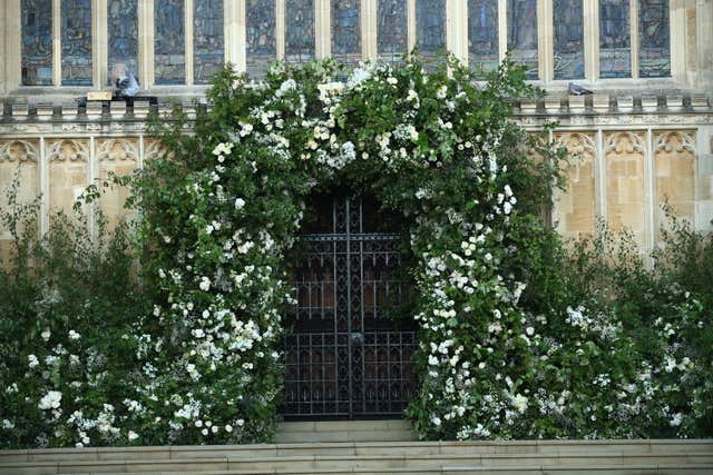 Flowers and foliage surrounded the West Door of St George’s Chapel at Windsor Castle (Danny Lawson/PA)