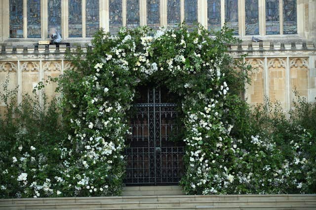Flowers and foliage surrounded the West Door of St George’s Chapel at Windsor Castle (Danny Lawson/PA)