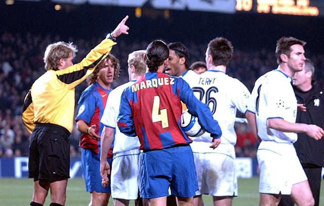 Referee Anders Frisk (far left) in charge of the Barcelona versus Chelsea match. (PA)