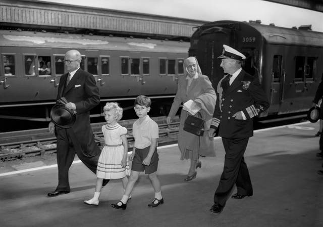 A young Prince Charles and Princess Anne, followed by their grandmother, Princess Alice, in 1955