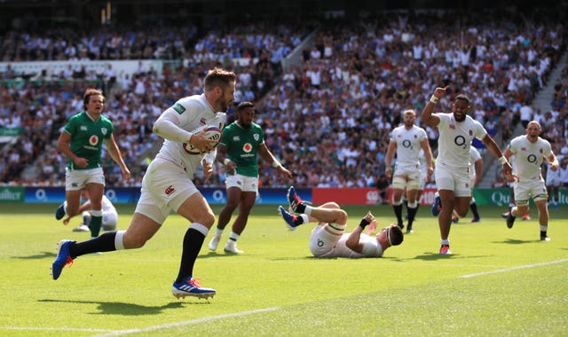 Elliot Daly runs in one of England's eight tries in their rout of Ireland at Twickenham 