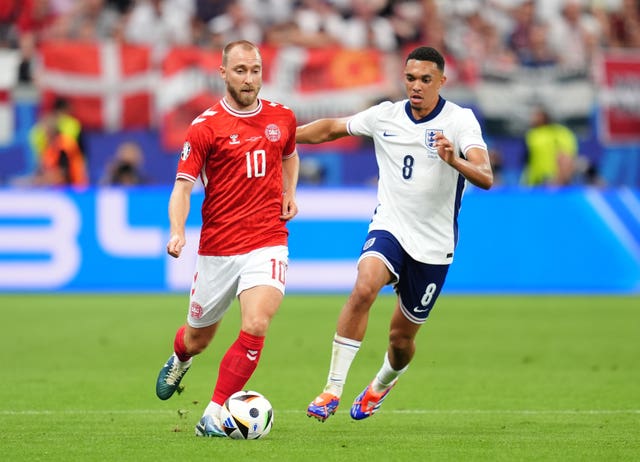 Trent Alexander-Arnold, right, challenges for the ball with Denmark midfielder Christian Eriksen