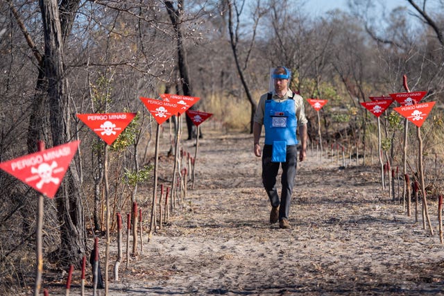 The Duke of Sussex walks through a minefield in Dirico, Angola, during a visit to see the work of landmine clearance charity the Halo Trust, on day five of the royal tour of Africa