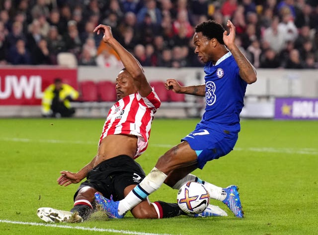 Ethan Pinnock, left, blocks a shot from Chelsea’s Raheem Sterling