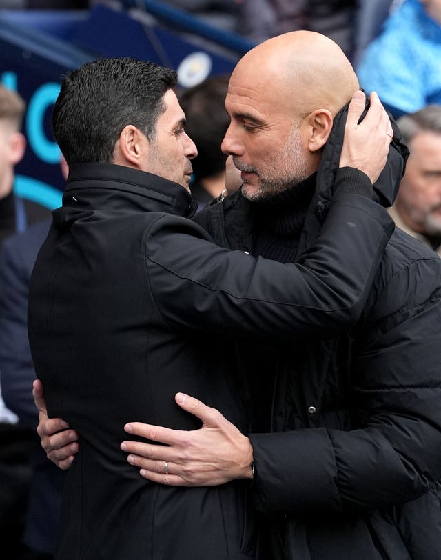 Mikel Arteta and Pep Guardiola embrace